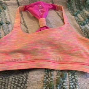 Bright orange and pink exercise bra.